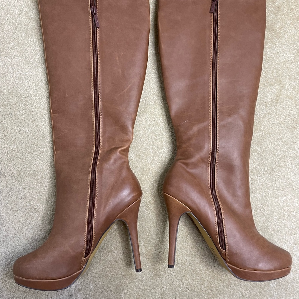 Super cute…Brand new never worn 5 inch heel brown leather knee high boots.